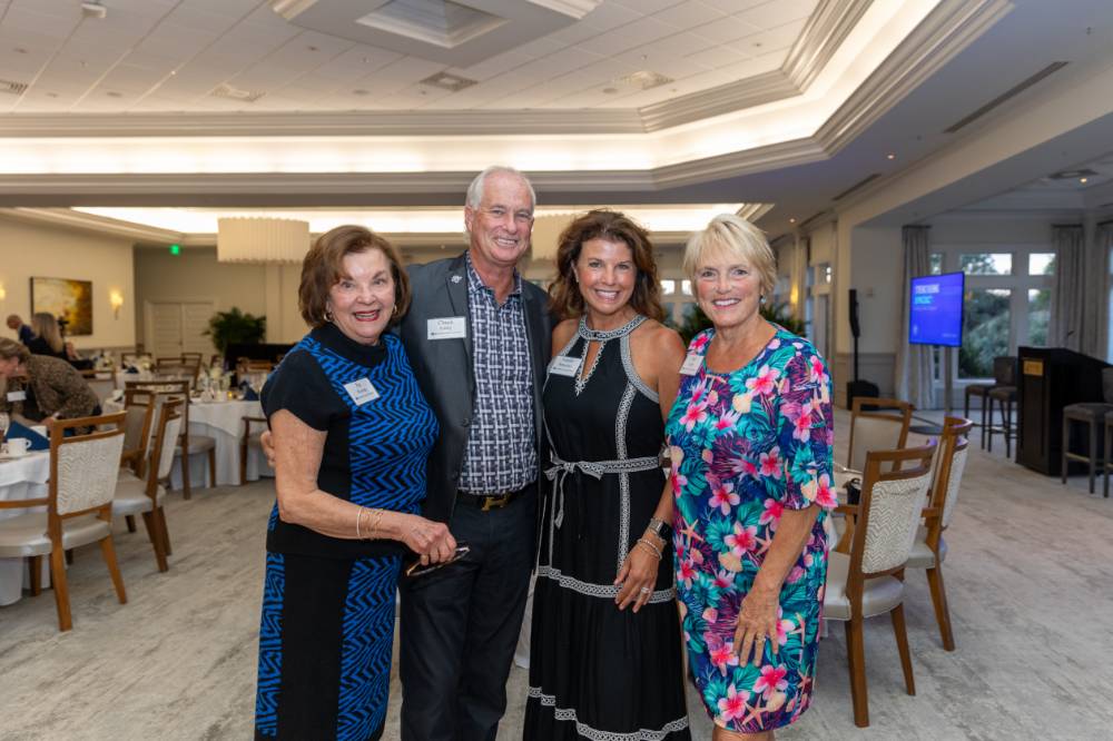 Pat Waring and Natalie Bernecker posing for photo with Chuck and Teri Losey